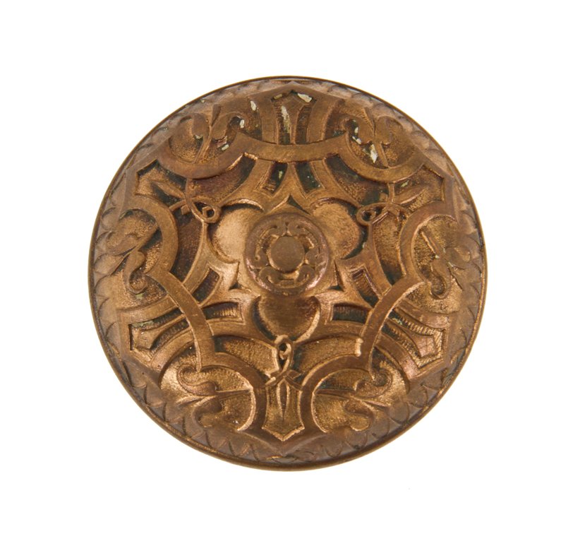 19th century antique american victorian era ornamental cast bronze banded rim residential doorknob with raised center containing a floral motif 