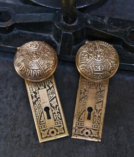 original 19th century american eastlake style "ceylon" pattern matching doorknobs and backplates salvaged from a chicago graystone