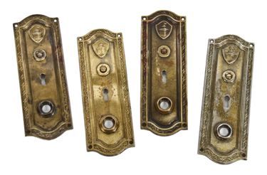 original and intact remarkable set of four matching early 20th century ornamental cast brass fort dearborn hotel doorknob backplates