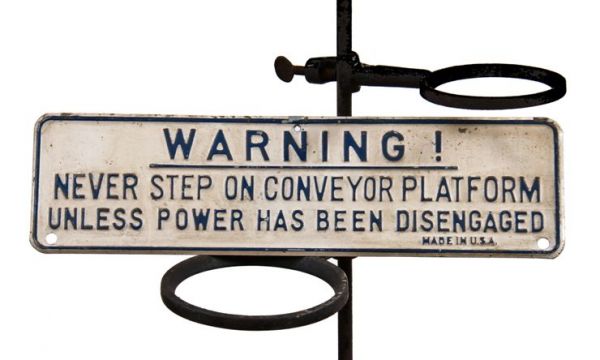 original and sought after c. 1930's vintage antique american salvaged chicago industrial "never step on conveyor" warning sign with deeply embossed lettering