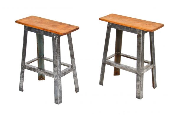 identical set of late 1940's vintage american industrial pressed folded furniture sheet steel side tables with worn maple wood tops