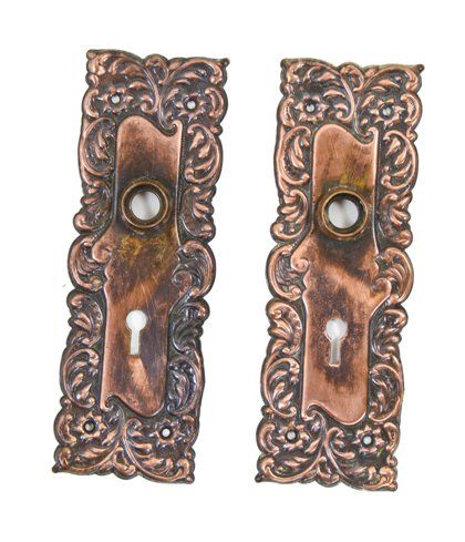 original and remarkably intact matching set of late 19th century antique salvaged chicago vintage ornamental wrought bronze "eulalia" pattern passage door backplates 