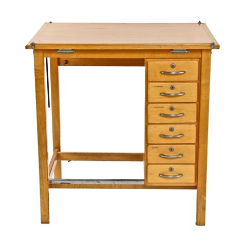 original c. 1950's vintage american industrial varnished maple wood  drafting table with a multitude of drawers