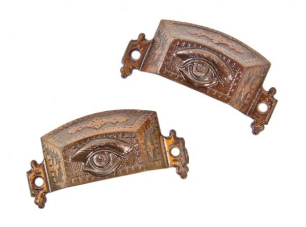 matching set of original late 1870's "amber bronzed" cast iron furniture cabinet drawer pulls with deeply embossed "all-seeing eye"