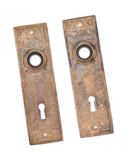 matching set of original 19th century ornamental wrought iron "ceylon" pattern residential passage door backplates 