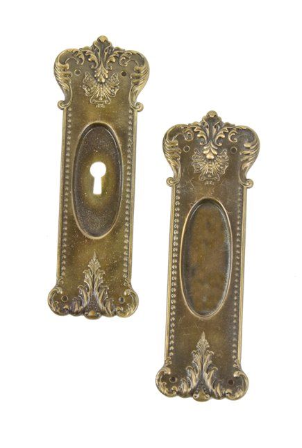 matching set of early american stamped ornamental brass metal interior residential pocket door with nicely aged patina