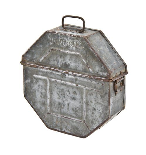 weathered and worn american industrial handheld octagonal-shaped  universal galvanized steel film reel case with embossed lettering