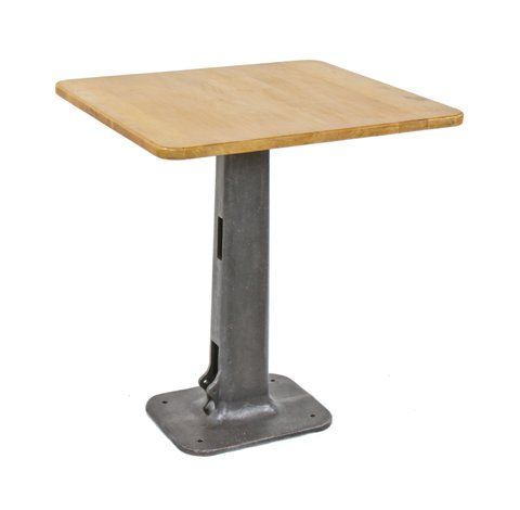 repurposed vintage american industrial pub table with old cast iron foot-operated riveter machine base and rounded edge wood tabletop