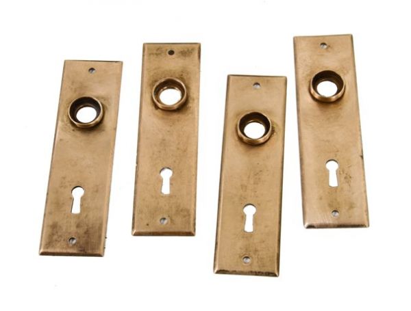 four matching 19th century american antique cast bronze interior residential passage door backplates or escutcheons