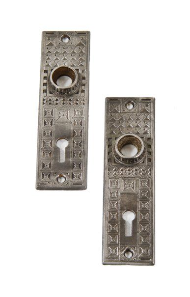 matching set of late 19th century american ornamental cast iron interior residential passage door backplates with fluted thimbles