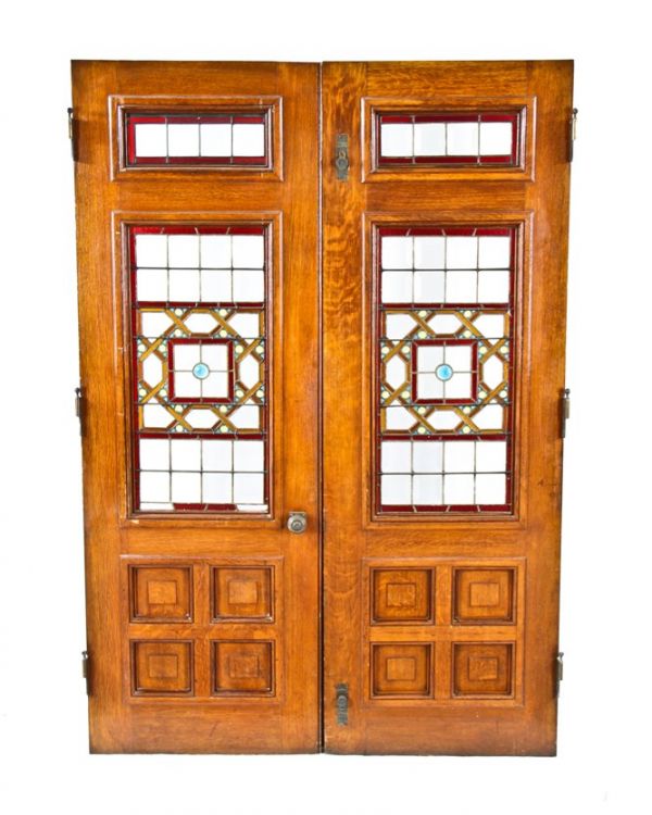 original and largely intact american high victorian era  c. 1885 interior residential varnished oak wood vestibule doors with leaded art glass insets