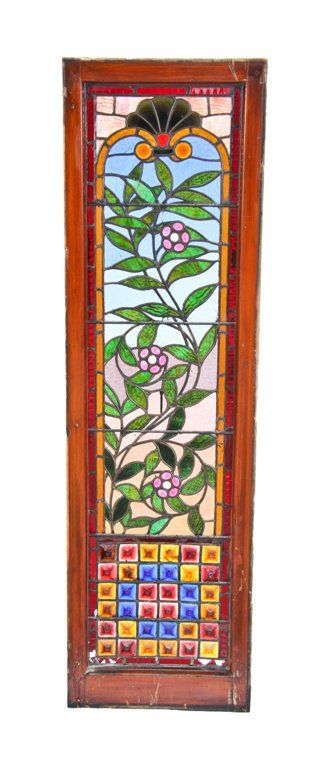 remarkable c. 1886 american aesthetic movement variegated leaded art glass window featuring abundant leafage and gridded chunk glass