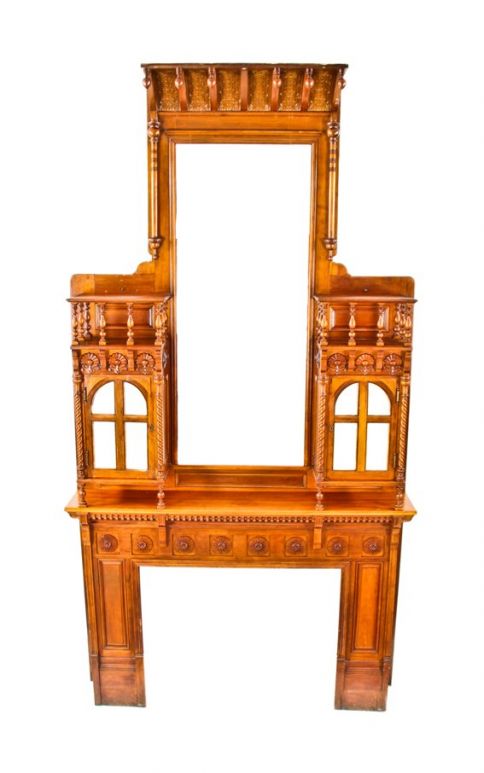 original extraordinary 19th century american hand-crafted david c. cook mansion cherry wood fireplace mantel featuring segmented beveled mirror hinged door cabinets