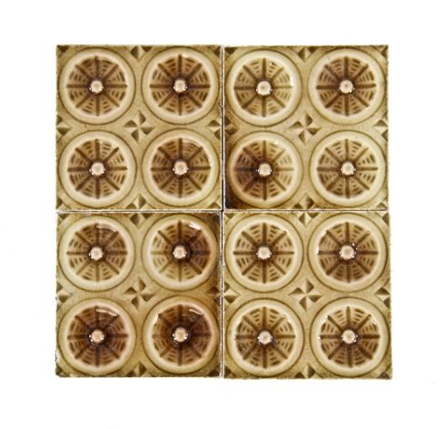 group of four matching c. 1880's strongly geometric american mottled brown majolica glazed ornamental interior residential fireplace tiles 