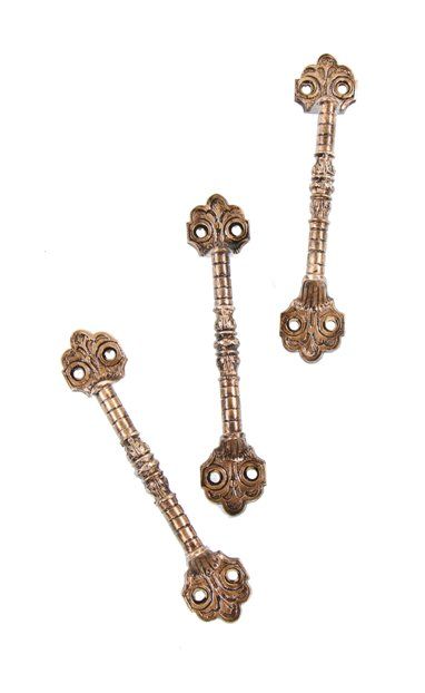 group of three matching c. 1880's high victorian fanciful cast brass interior residential window sash pulls or lifts with nicely detailed floral motifs