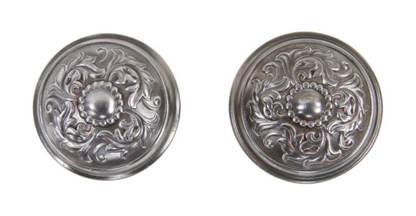 matching set of highly ornate early 20th century american stamped or pressed steel passage size residential doorknobs