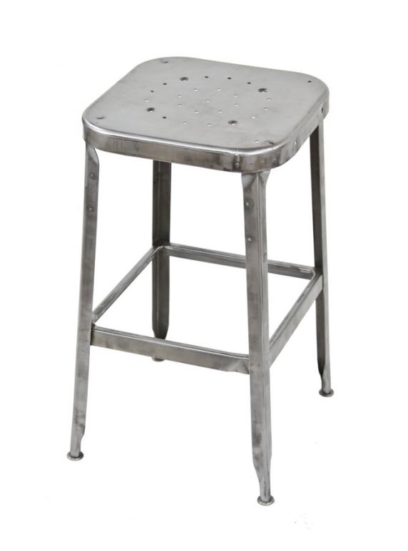 stripped down american vintage industrial four-legged "lyon" cold-rolled steel stationary assembly line work stool with pierced metal seat