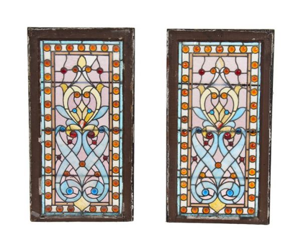 stunning pair of original and largely intact 19th century american victorian era residential stained glass windows bedecked with richly colored faceted jewels