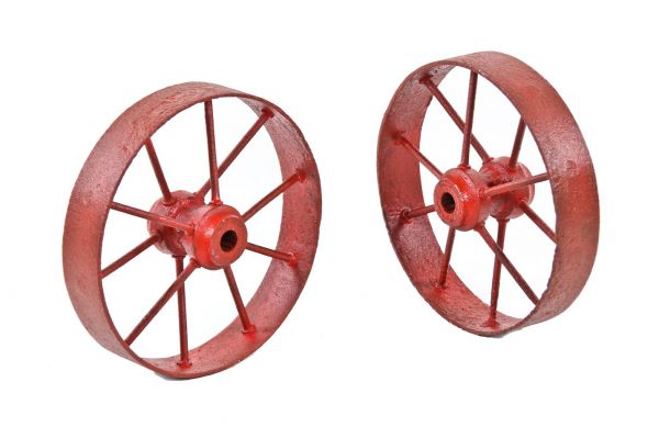 original matching pair of heavily reinforced all-welded early 20th century american industrial wrought iron double-sided spoked wheels 