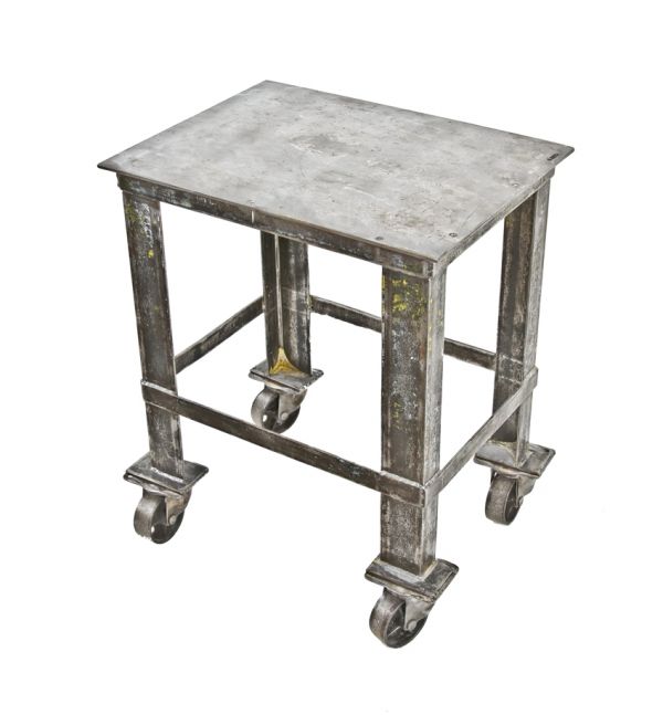 structurally sound original heavily reinforced welded joint solid steel mobile factory cart with flat steel deck and pierced cast iron casters