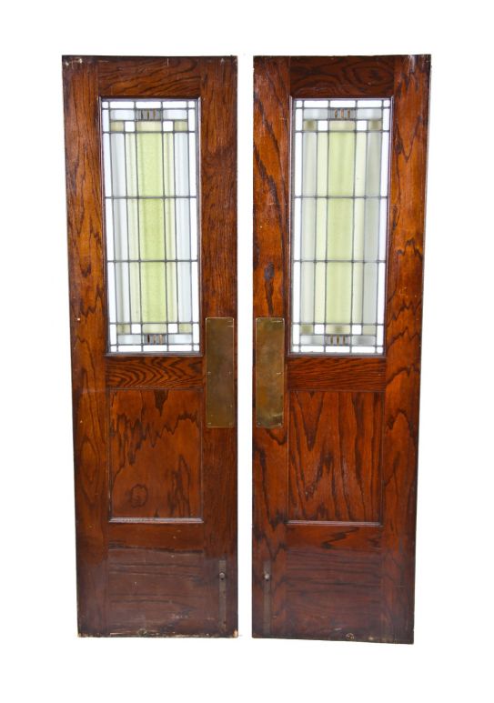pair of matching original and intact early 20th century interior residential art glass and oak wood swinging doors attributed to william drummond