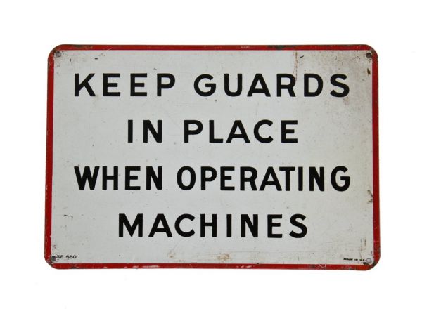 american industrial wall-mount baked enameled steel "keep guards in place" factory instructional sign with minor surface wear