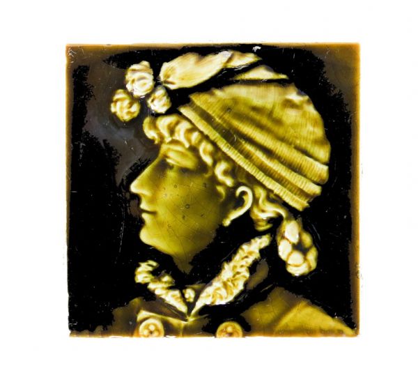original and largely intact american 19th century victorian era majolica glazed residential fireplace portrait tile featuring a woman with headdress