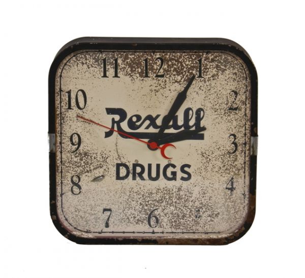 original and fully functional american depression era "rexall drugs" wall-mount electric clock with chrome accent