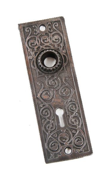 highly ornamented late 19th century original ornamental cast iron passage door backplate with fluted or grooved thimble