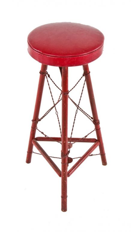vintage american industrial three-legged red painted stationary stool reinforced with twisted steel wire