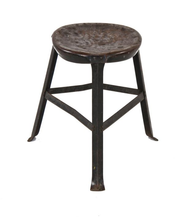 heavily worn original c. early 1940's vintage american industrial riveted joint three-legged factory machine shop stool with old backed black enameled finish
