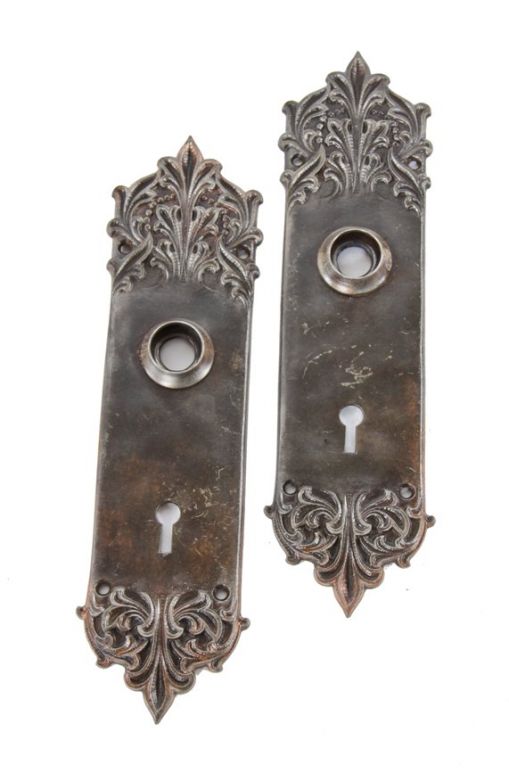 original antique american early 20th century decorative cast iron "panama" pattern interior residential passage door backplates with wrought steel thimbles