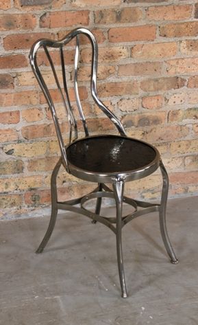 c. early 20th century restored pressed and folded "uhl art" chrome plated steel joe uhl-designed "perfection" chair with black enameled seat