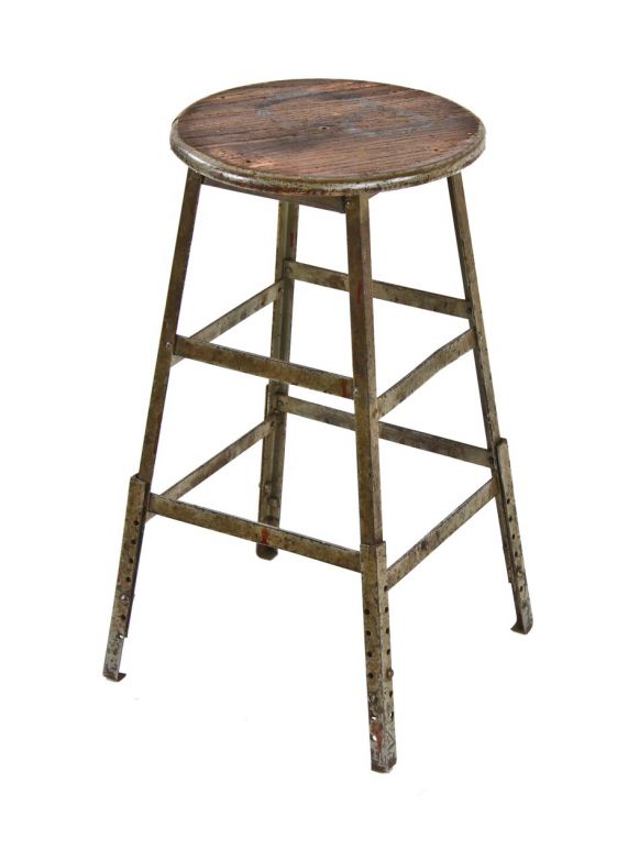 1940's american vintage industrial four-legged adjustable height riveted joint angled iron machinist stool with solid timeworn oak wood seat