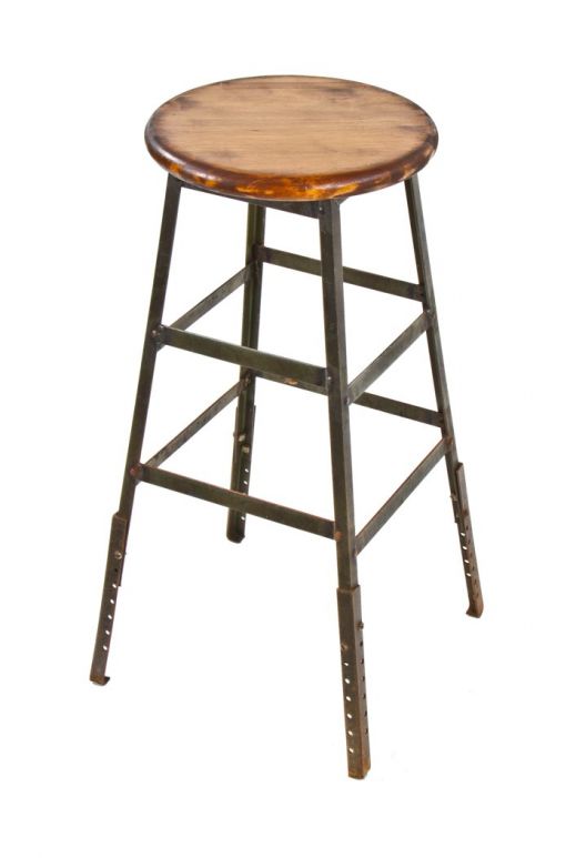 1940's vintage american industrial adjustable height angled steel four-legged factory machine shop stool with solid maple wood seat