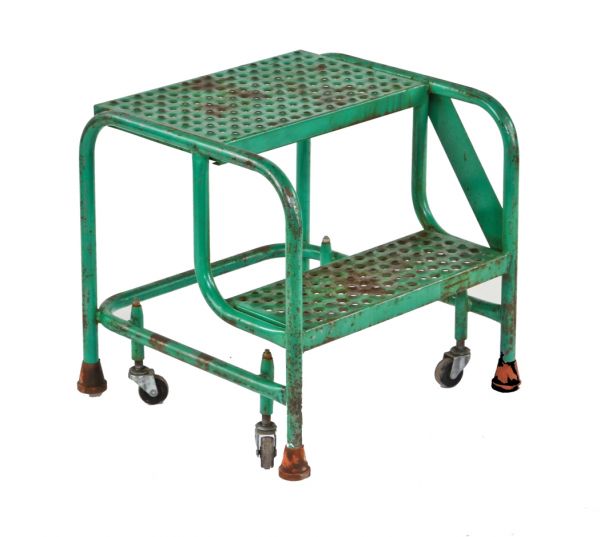 late 1950's original and fully functional american vintage industrial two-step tubular steel spring-loaded caster mobile stepladder