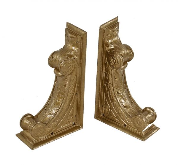 highly stylized early 20th century neoclassical style metallic gold enameled ornamental cast iron bank building interior corbels or brackets