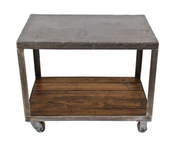 robust vintage american industrial all-welded joint heavy gauge steel two-tier mobile chicago factory supply storage cart with uniform brushed metal finish 