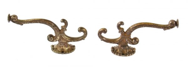 set of original 19th century chicago graystone parlor room console  oversized decorative coat hooks with partially intact brass-plated finish
