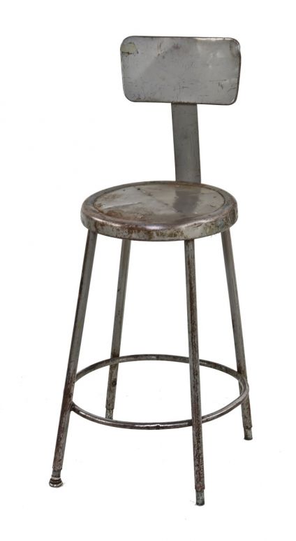 c. 1950's american industrial gunship gray enameled four-legged tubular steel factory machine shop stool with circular heel ring
