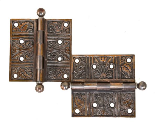 completely intact and well-maintained all original 19th century ornamental cast iron passage door hinges with floral motifs 