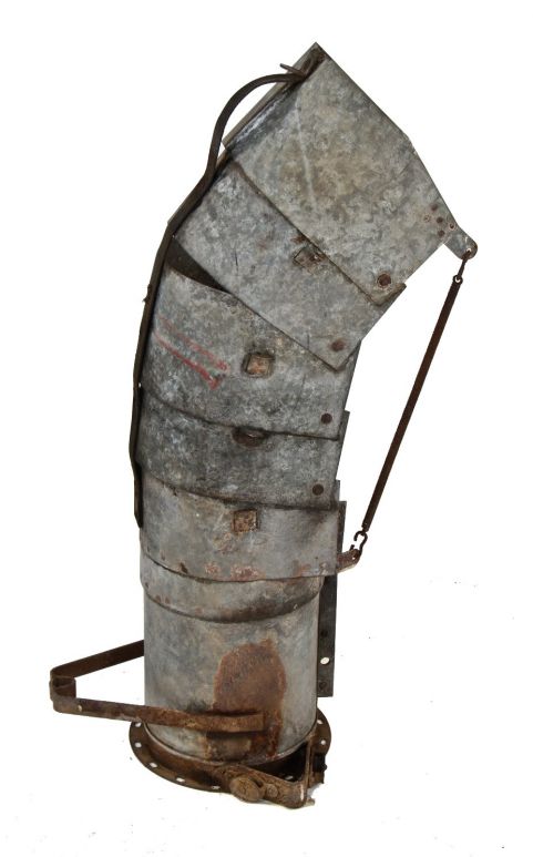 depression era american industrial freestanding galvanized steel grain elevator or farm blower or chute implement with flexible overlapping riveted plates 