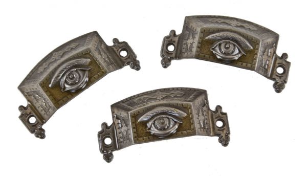 group of three original c. 1870's original antique american ornamental cast iron "seeing eye" cabinet drawer pulls with brushed metal finish 