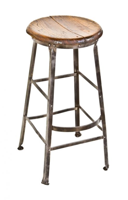 late 1920's american industrial freestanding riveted joint angled steel penitentiary workshop stool with convict identification  