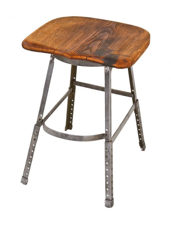 signed antique american c. 1930's industrial four-legged adjustable height reinforced angled steel "royal" factory machine shop stool with saddle seat
