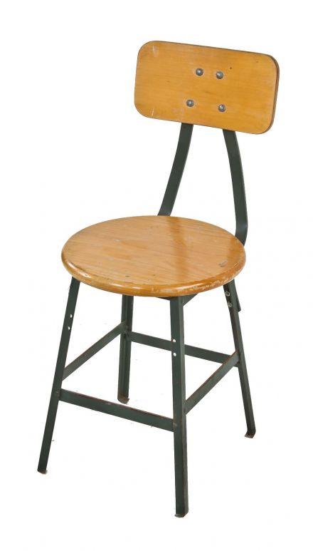 very clean and well-maintained c. 1950's american vintage industrial four-legged "pollard green" enameled riveted joint angled iron factory machine shop stool 