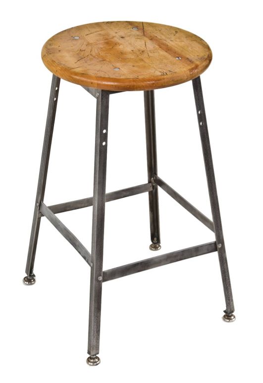 single late 1930's antique american four-legged industrial freestanding pollard factory machine shop stool with riveted joint angled iron base and original solid maple wood seat