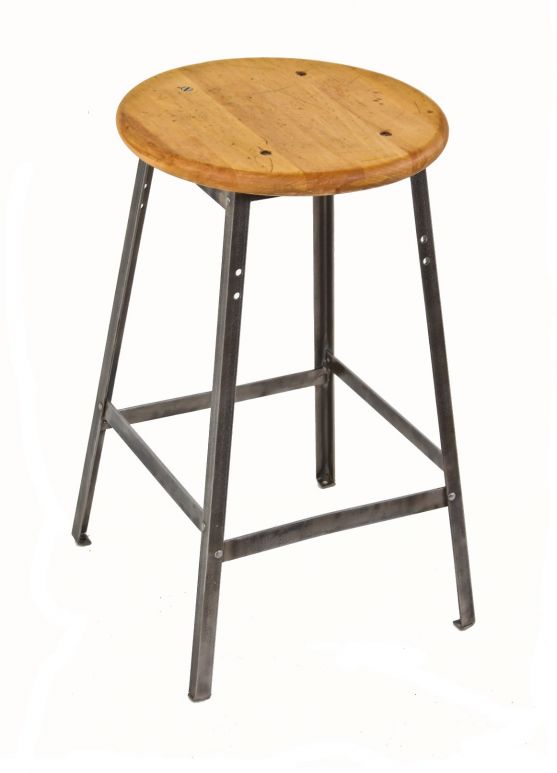 original early 1950's pollard brothers four-legged refinished angled iron stationary machinist stool with riveted joint stretchers and solid maple wood circular seat