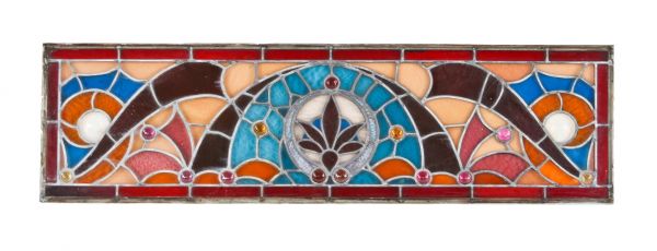 impressive oversized vibrantly colored late 19th century original american victorian era ornamental stained glass transom window with several jewels