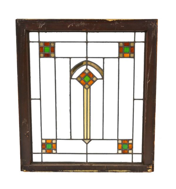 all original and intact american prairie school style leaded art glass chicago bungalow window with a rectilinear grid featuring colorful geometric shapes